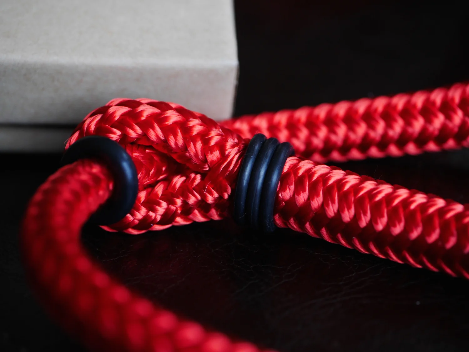 The wrist strap has a simple yet clever method of ensuring the strap doesn't cinch too tightly on your wrist. The rubber grommet slides easily when you want it to, and doesn't when you don't.