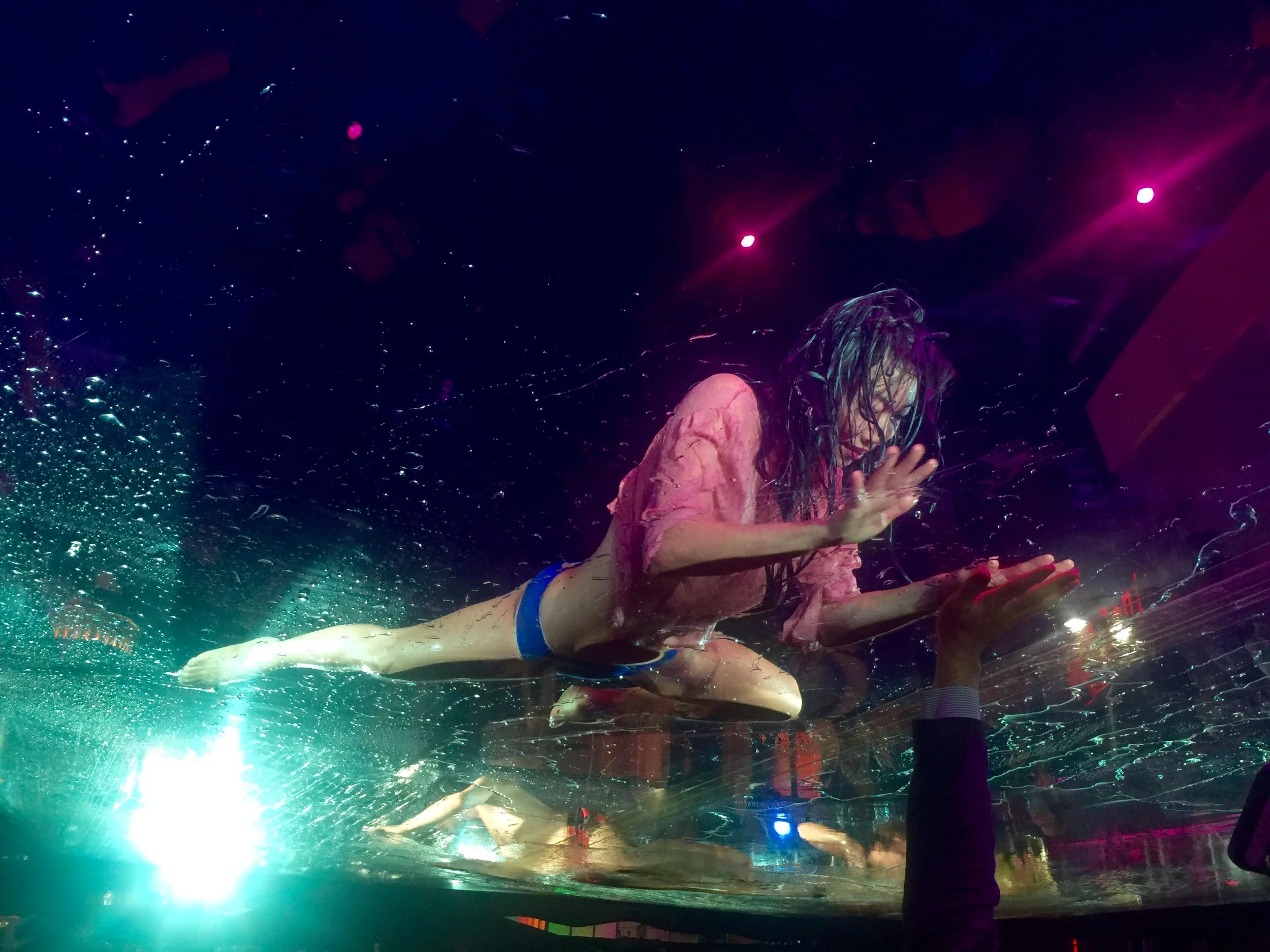 She's splashing in water… on a huge sheet of plastic… over our heads. Hello?!