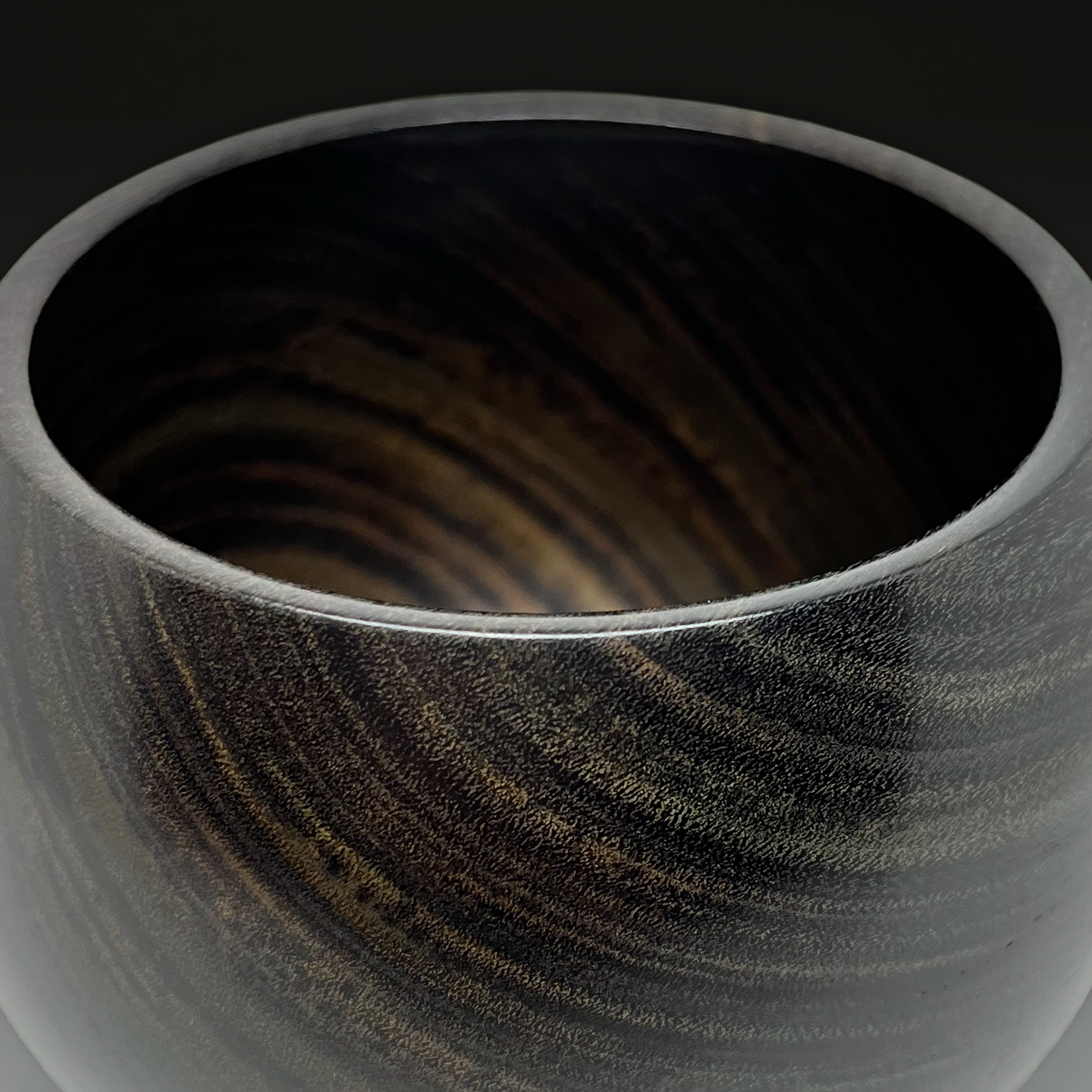 Turned lignum vitae vessel with figured grain