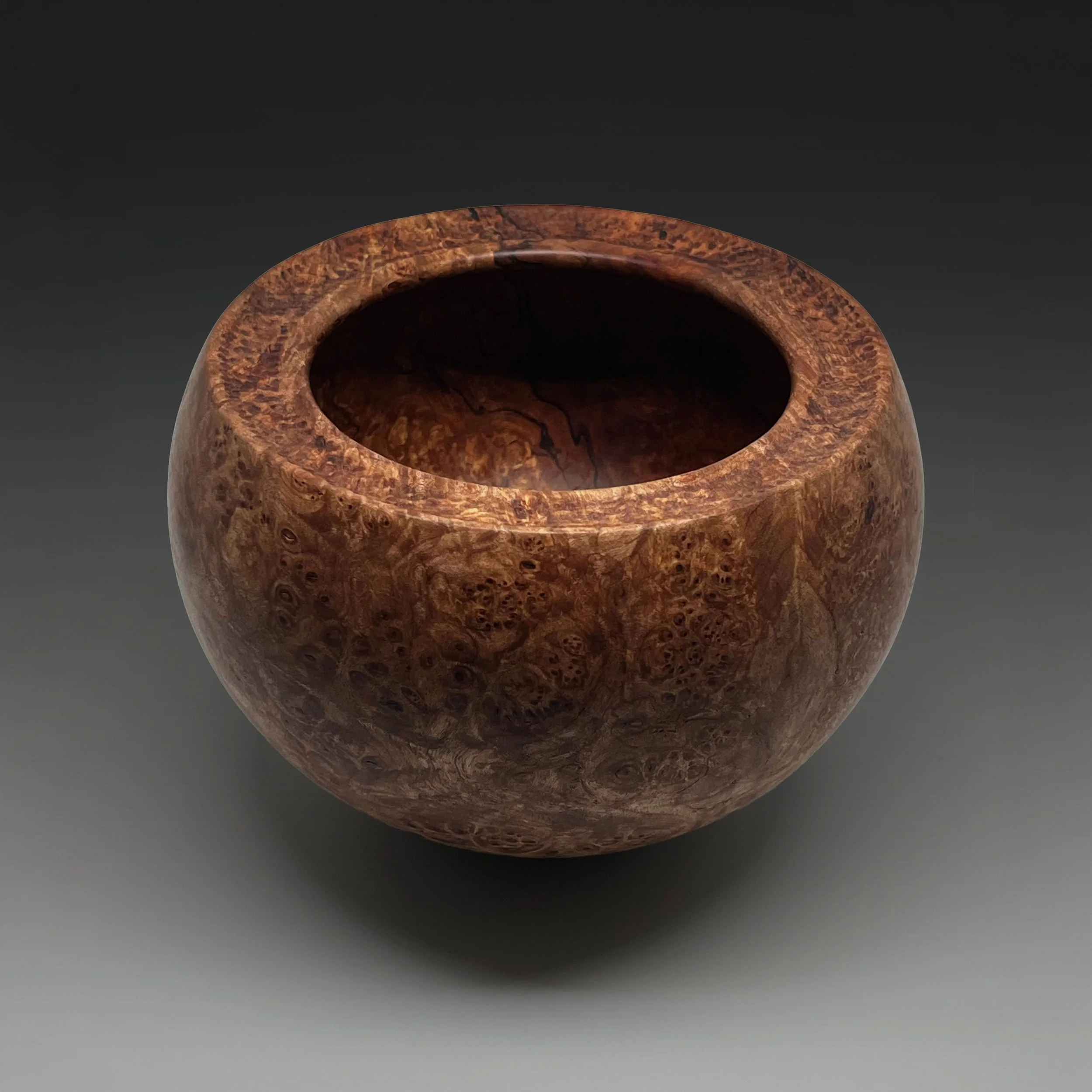 Maple burl vessel with beautiful figure,  hand carved rim