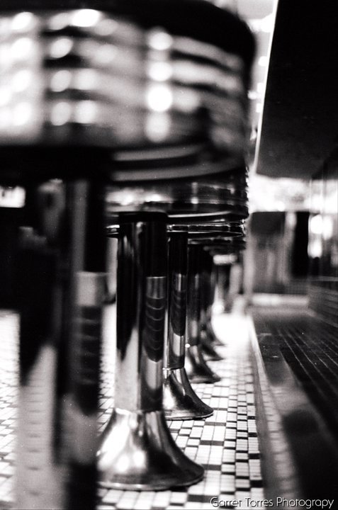One of the first photos I can remember being happy about. I took this one in my college's on-campus diner in 2010. Minolta XG-1 on Ilford 400 HP5 Plus film.