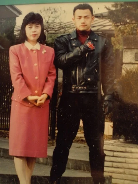A young Kamiya, pictured with his mother. What a badass.