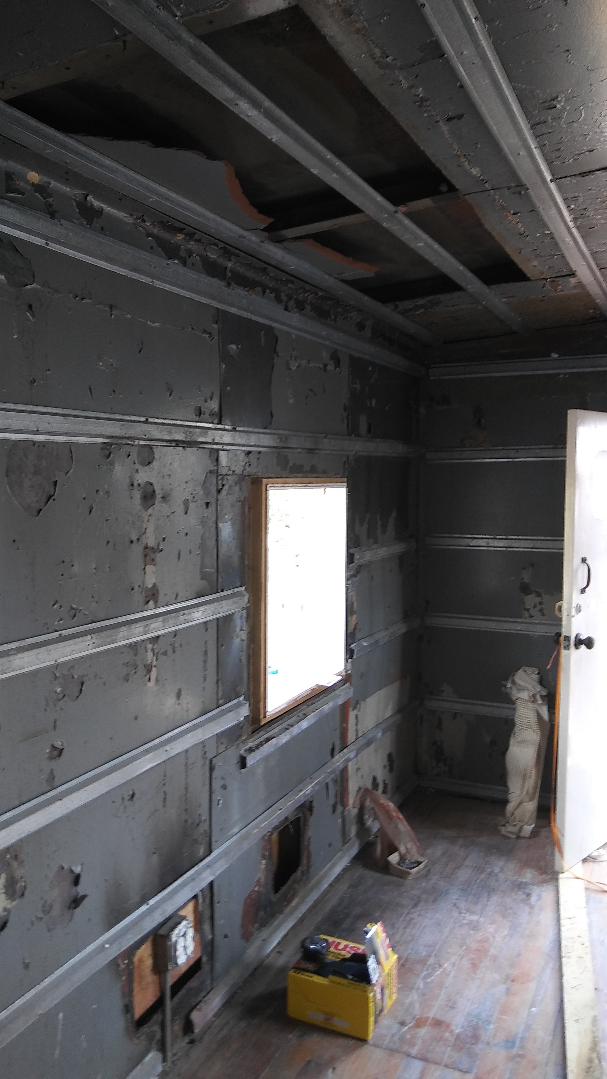 Ceiling and wall detail on the south side of the caboose. The metal studs were added to hang the sheet rock. There is space for blow-in insulation in between the ceiling, wall and external wall/roof. There was also a lot of evidence of rodent life.
