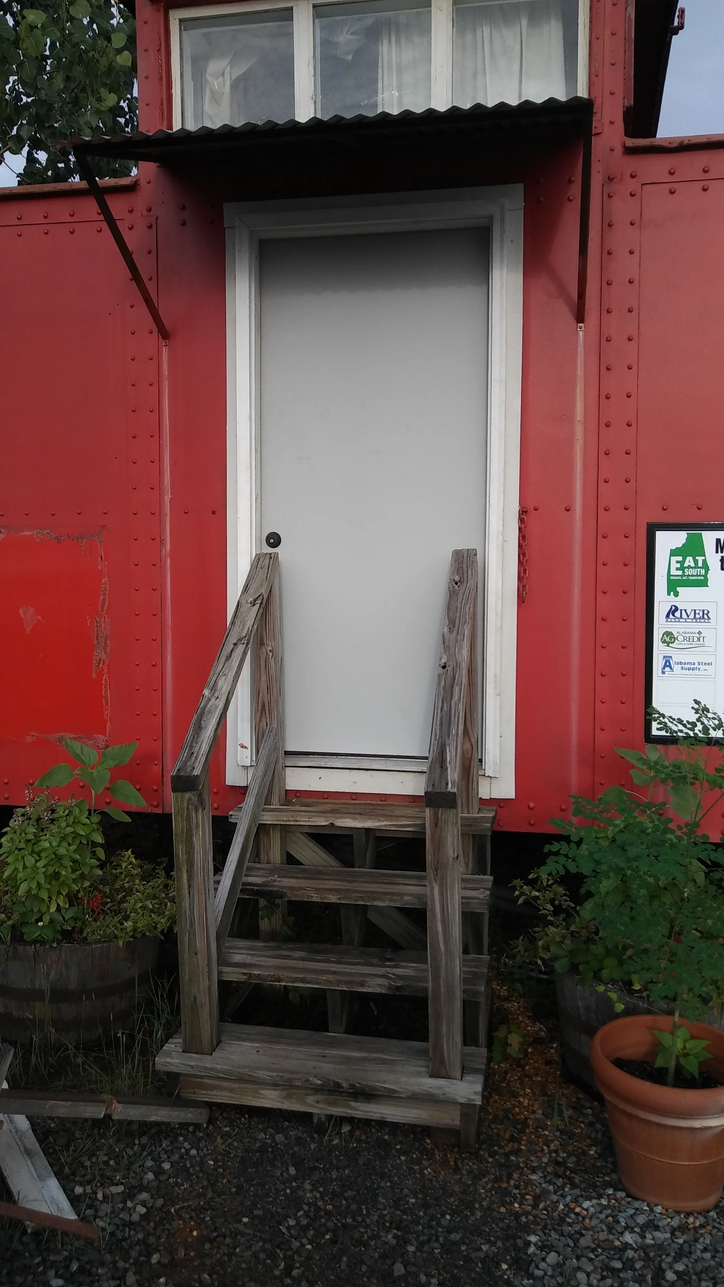 A new, steel front door - imagine it painted a bright color with a rectangle of chalkboard paint. When we're finished, we'll post the week's activities on the door.