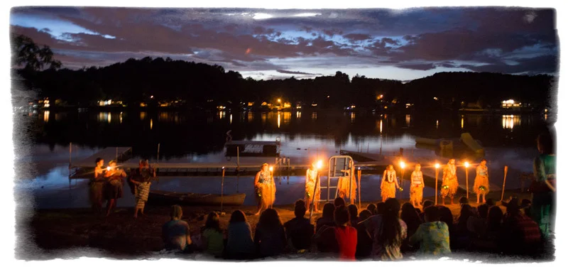 Color Wars Opening Ceremony at night on the lake.