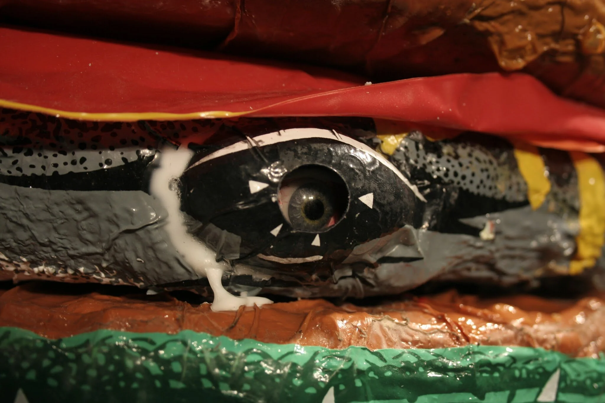  The glass eyes give the sculpture a soul or personhood, like the trick portrait painting with holes for eyes that follow you in the room, a human trapped inside the beast gazing out in mute terror, unable to even blink. 