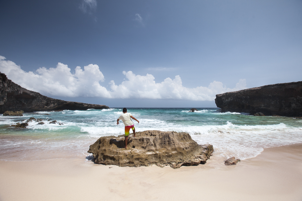 Beautiful Boca Prins beach hidden behind the rocks