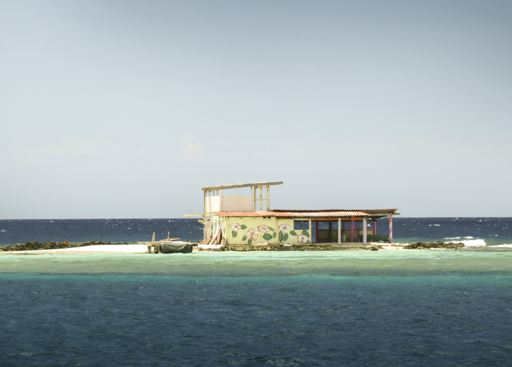 In the distance you'll find a traditional beach hut, painted in contrasting colors