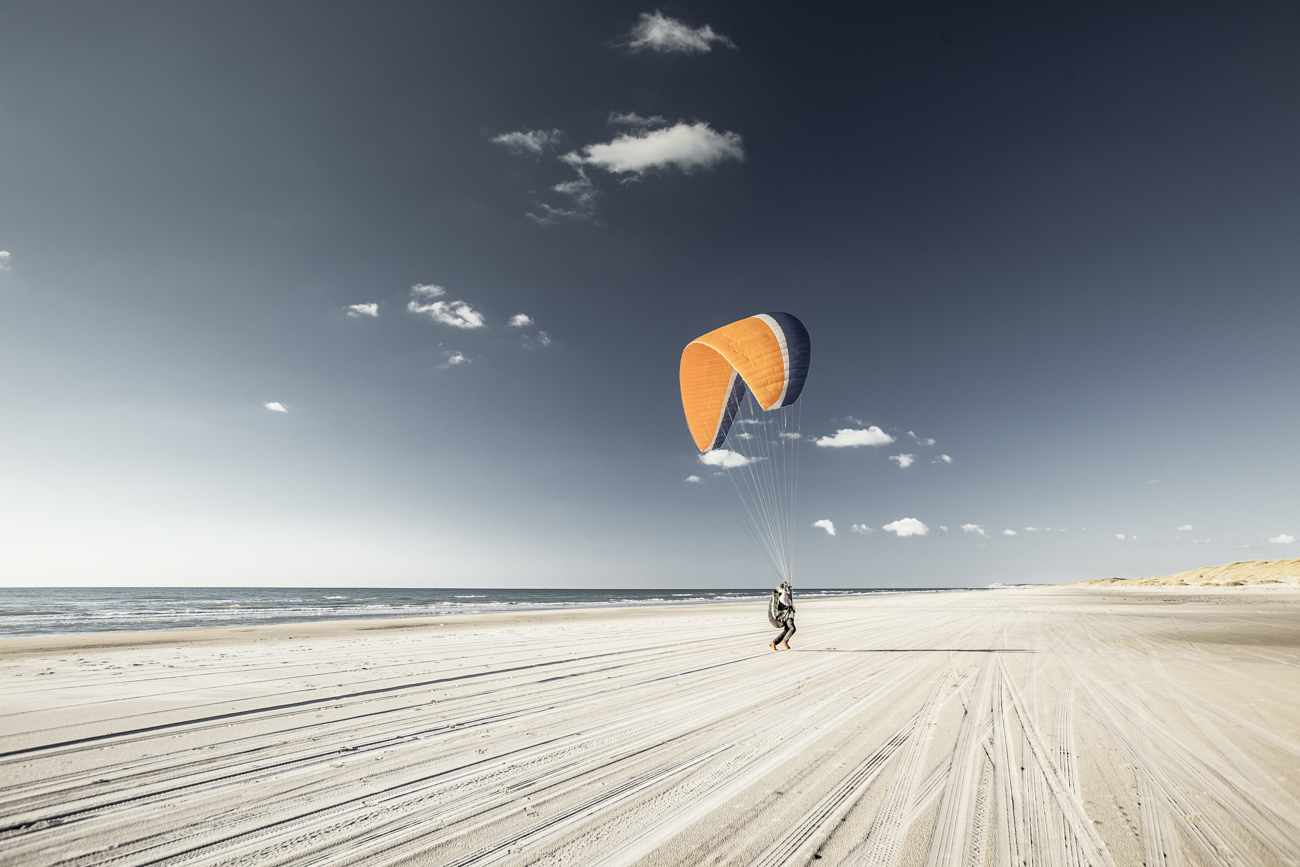 A parasailer on the beach. Such a great sight in the low sun.