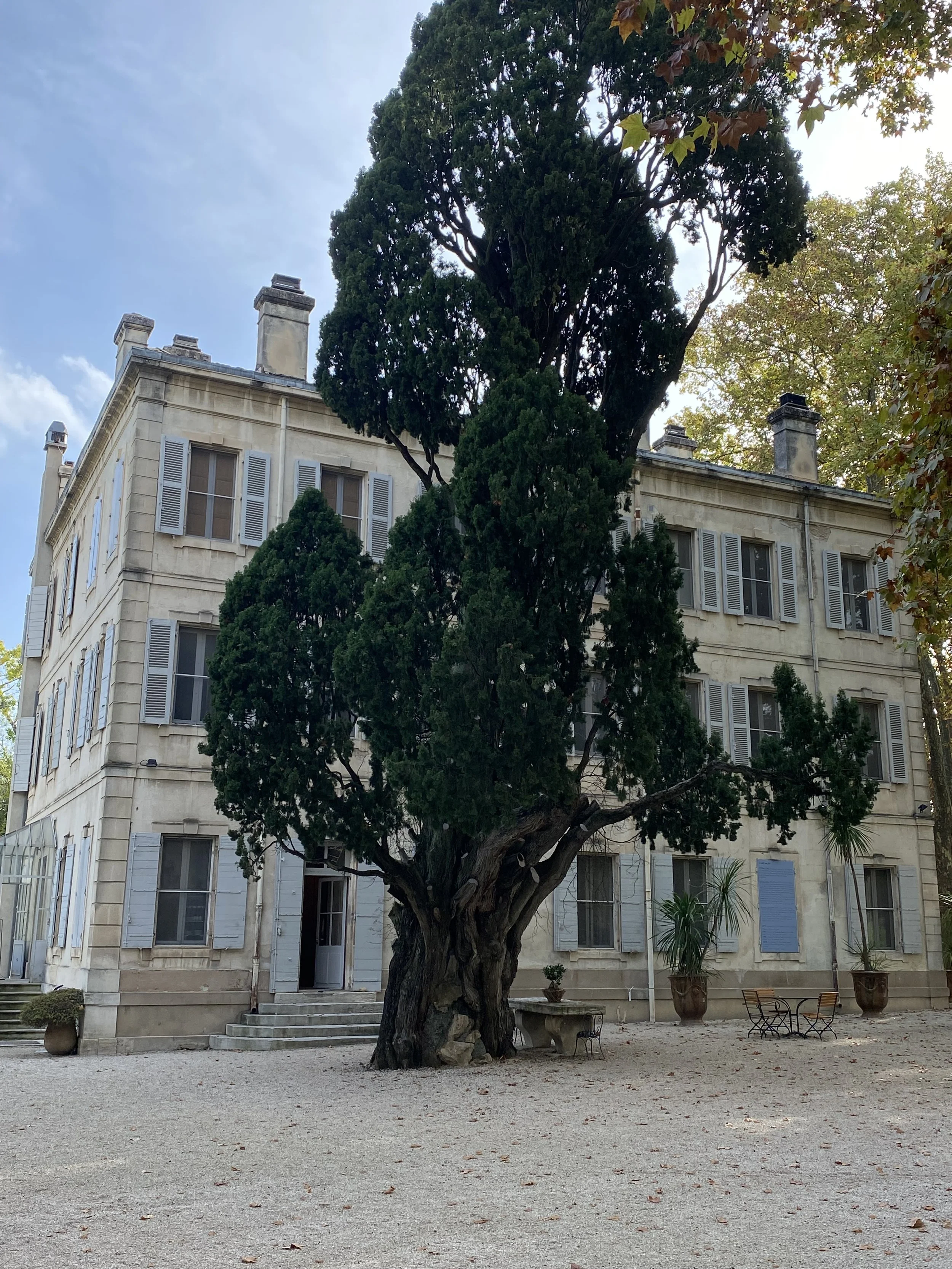 3 story french country house with pale blue shutters