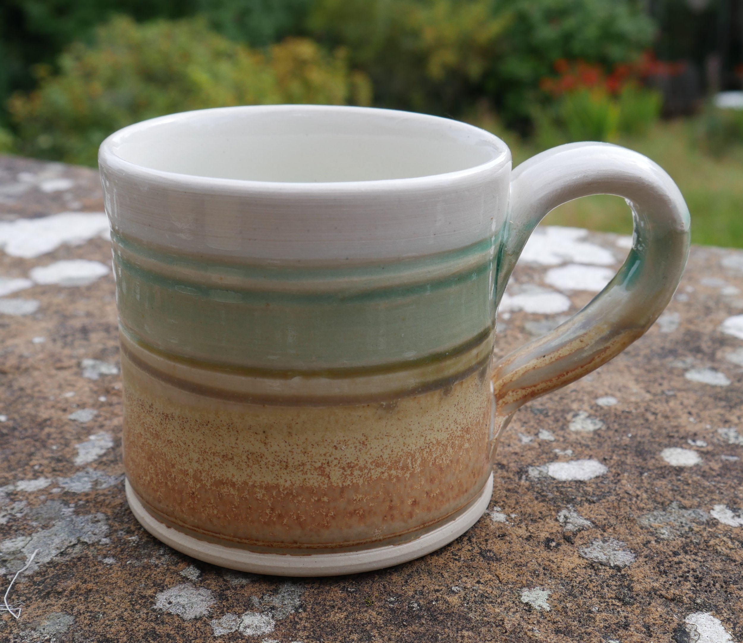   White, green slip    Oatmeal and clear glaze.    Mocha diffusion on interior    8.5cms x 8.5 cms    £20.00  