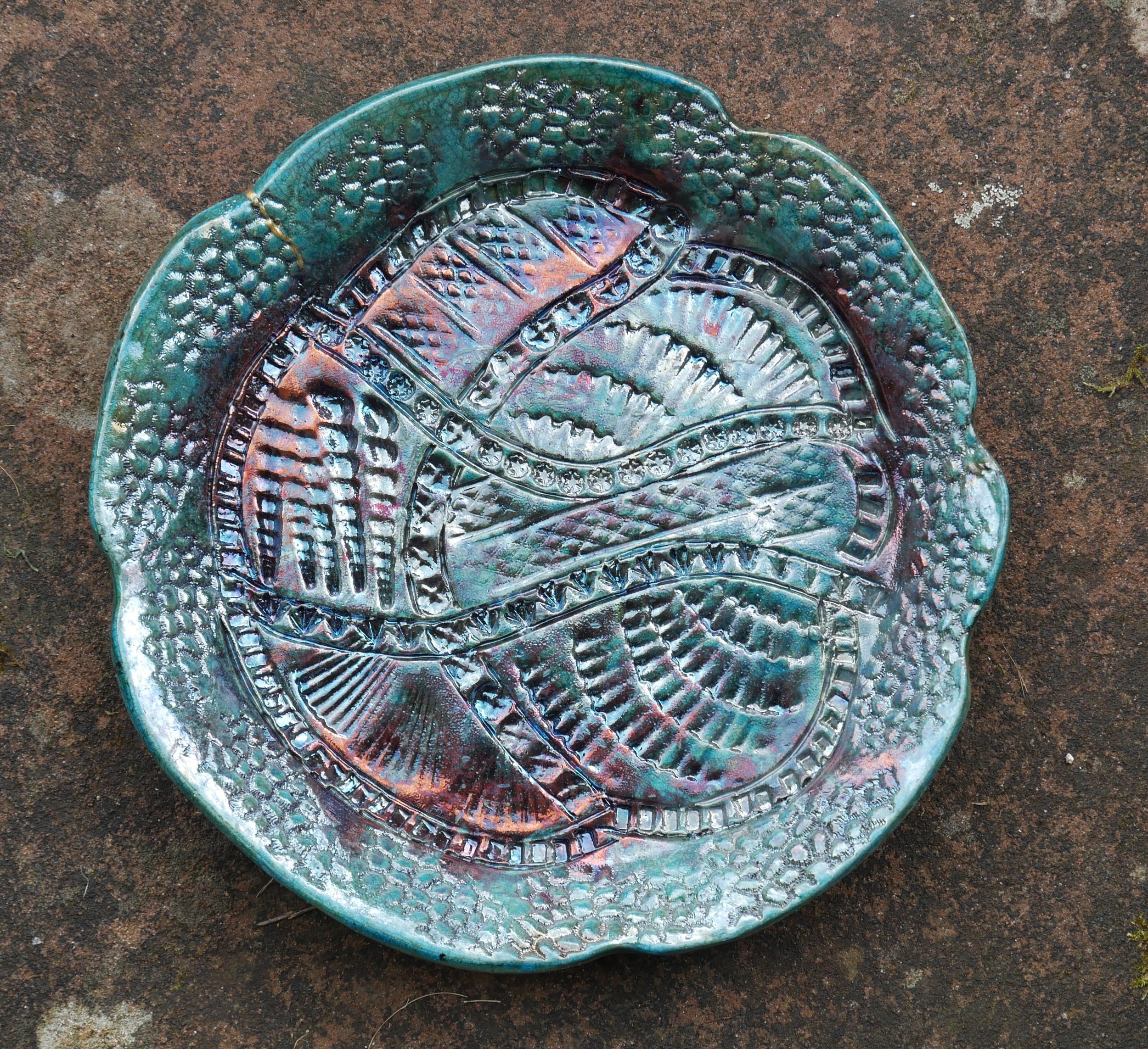   Raku fired, pressed decoration    28 x 4 cms    £65.00  