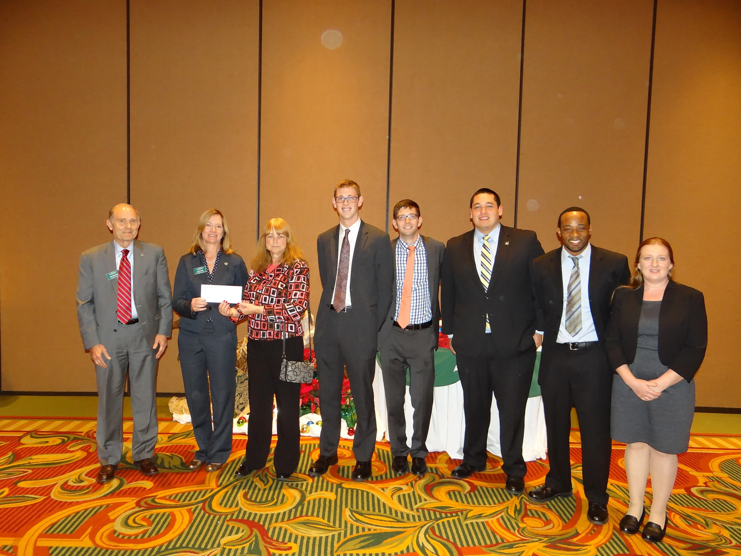 The presentation of the $10,000 donation check to UNC-Charlotte.