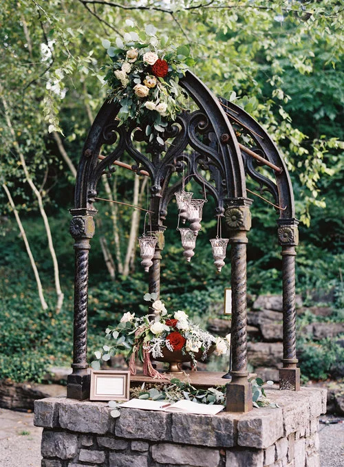 The guestbook at Lily &amp; Jeff's wedding was setup on a wishing well at Cheekwood Botanical Gardens in Nashville, TN. Wedding planning and design by Big Events Wedding.