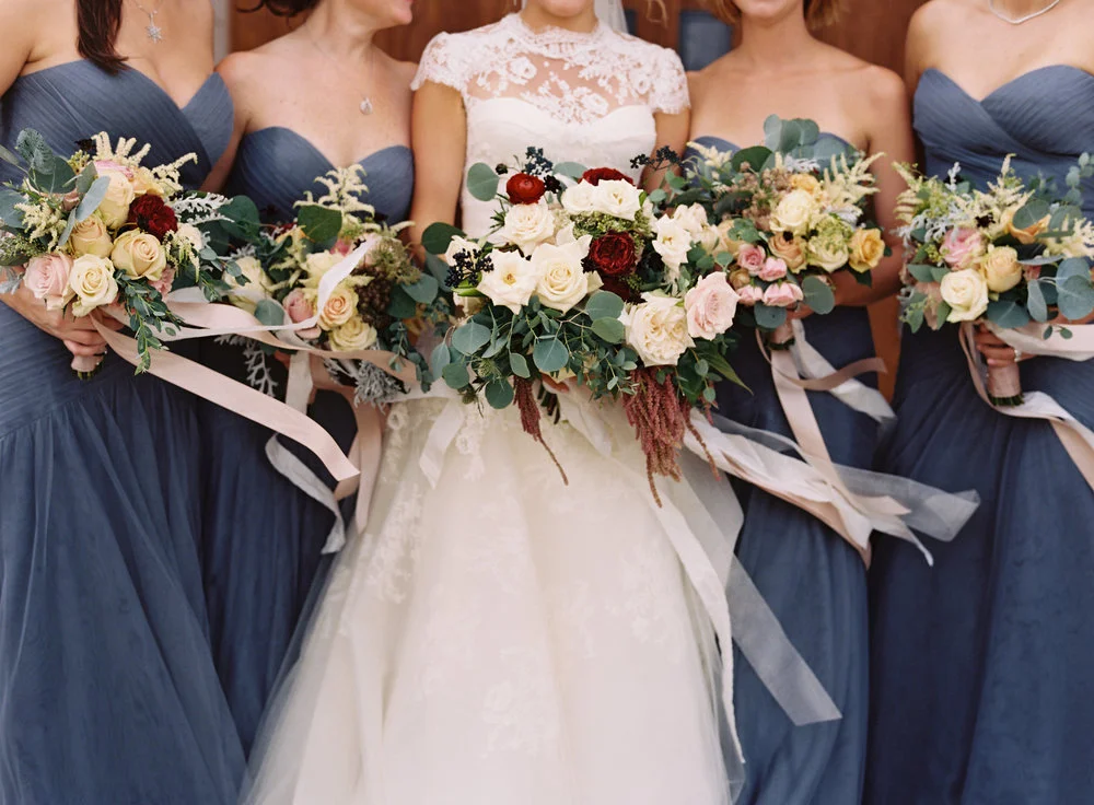 The bride poses with her bridesmaids and beautiful floral arrangements just before her wedding at Cheekwood Botanical Garden &amp; Museum of Art in Nashville, TN. Weddng, design, and flor arrangements by Big Events Wedding.