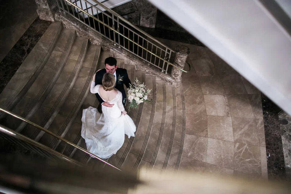 The newly weds steal a moment before their wedding reception at Schermerhorn Symphony Center in downtown Nashville, TN. Wedding planning &amp; design by Big Events Wedding.