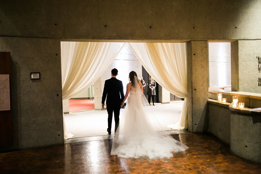 The Horne couple get ready to greet their loved ones moments after getting married at the Country Music Hall of Fame. Wedding planning &amp; design by Big Events Wedding.