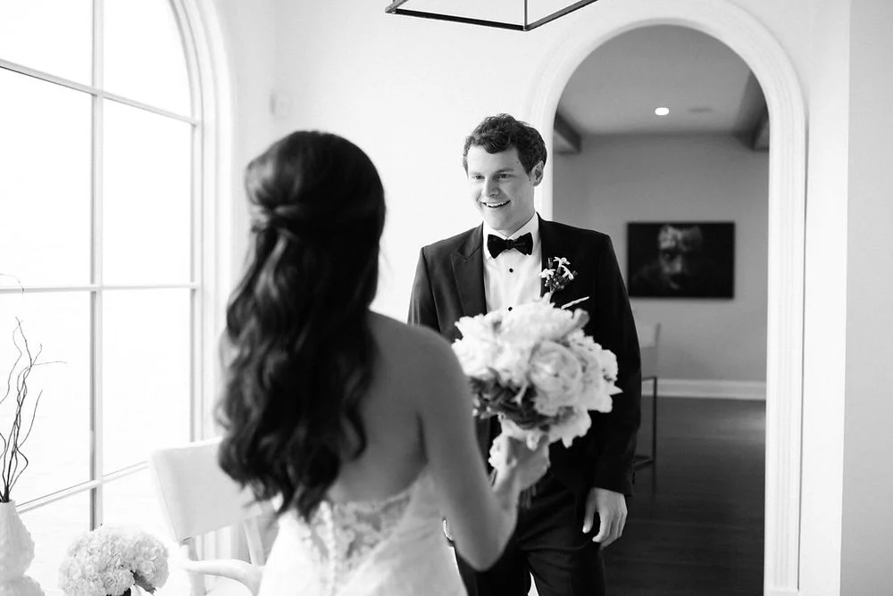 The groom sees his stunning bride at the Frist Center for the Visual Arts in Nashville, TN. Wedding planning &amp; design by Big Events Wedding.