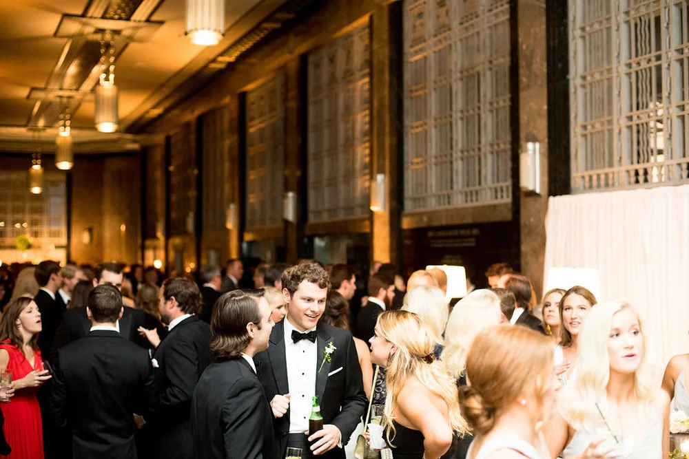 Guests celebrate at the Gilbert Wedding Reception at the Frist Center for the Visual Arts in Nashville, TN. Wedding planning &amp; design by Big Events Wedding.