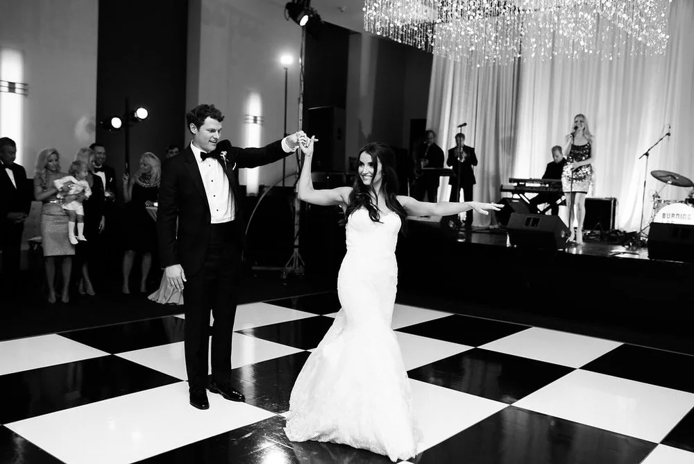 The bride &amp; groom share their first dance shortly after getting married at the Frist Center for the Visual Arts in Nashville, TN. Wedding planning &amp; design by Big Events Wedding.