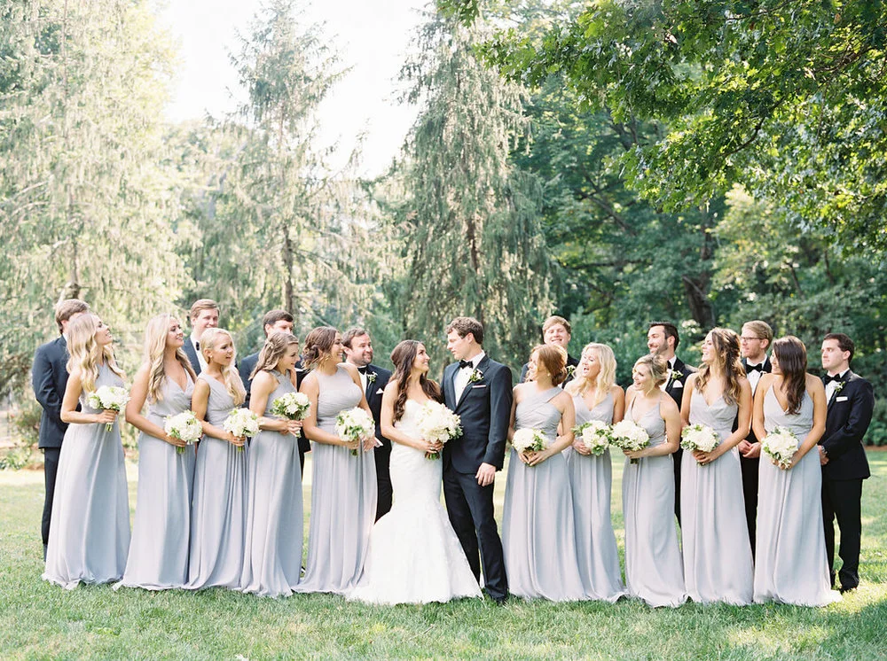 The Bride &amp; Groom with their bridesmaids and groomsmen just before their wedding at the Frist Center for the Visual Arts in Nashville, TN. Wedding planning &amp; design by Big Events Wedding.