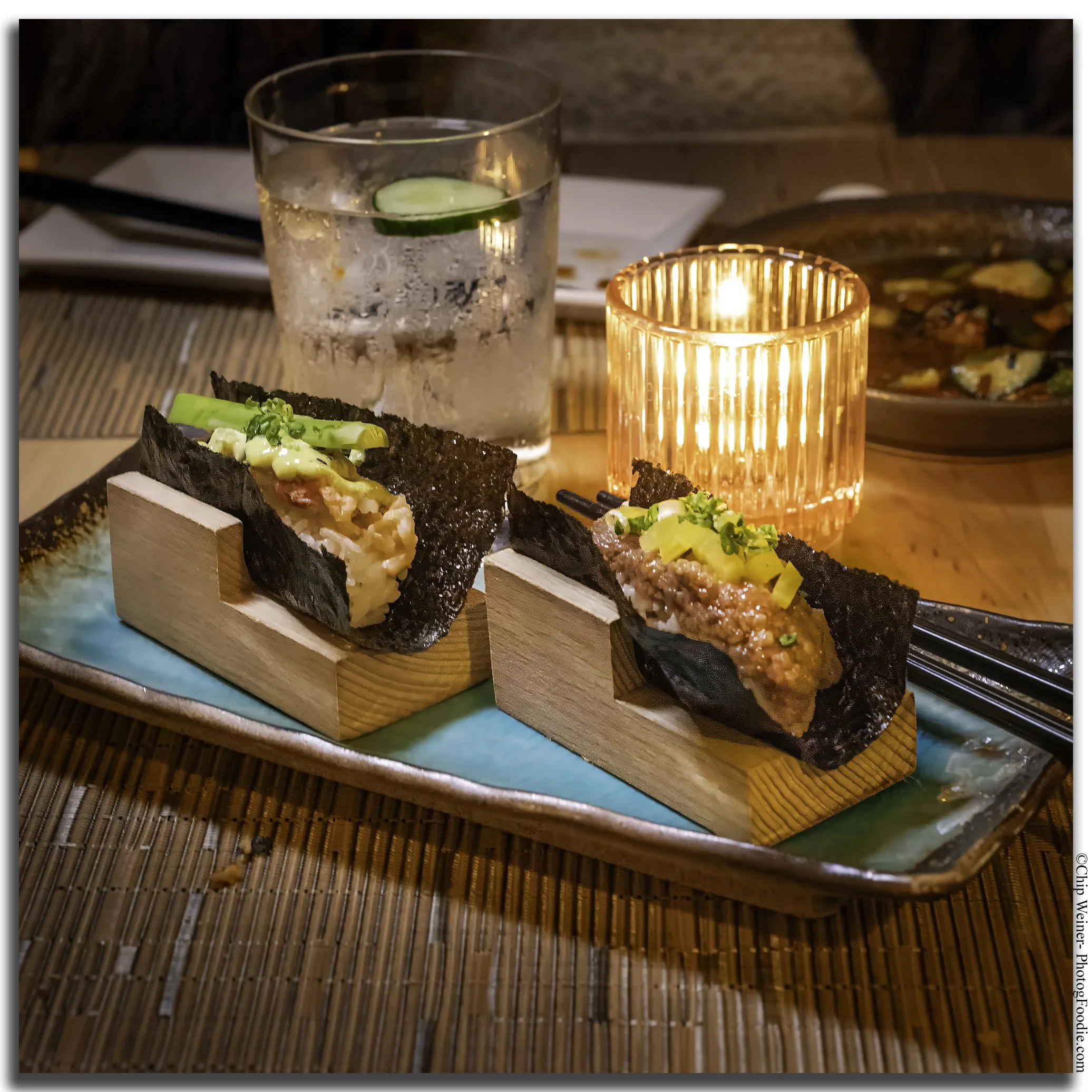 Akami hand roll at O-Ku Tampa featuring lean bluefin tuna, wasabi guacamole, and crunchy bubu arare in a nori seaweed wrap.