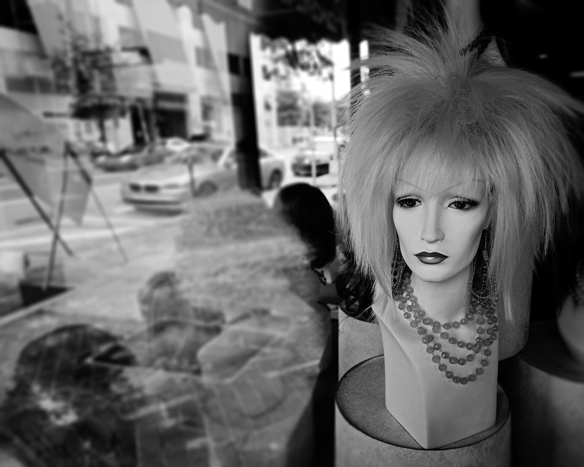 My favorite street photos have a human element along with an urban feel. That's what I tried to capture here.