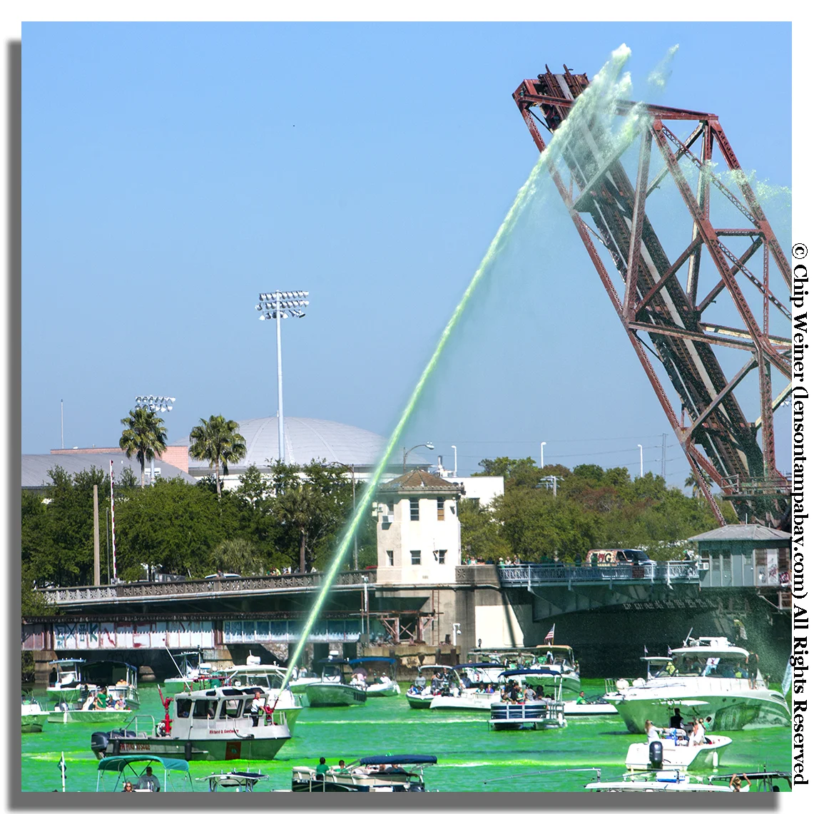Tampa Fire Department fire boat the Richard D Santmyer sprays green water over the celebrating boats at the 2018 Mayor's River O'Green