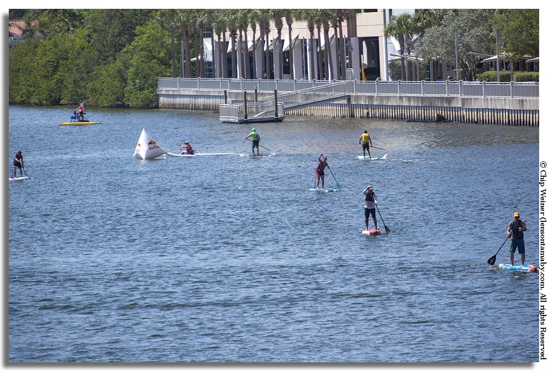 Competitors turn at he halfway point buoy in Seddon Channel close to the Tampa Convention Center for the Gasparilla Stand Up Paddle Board Invasion