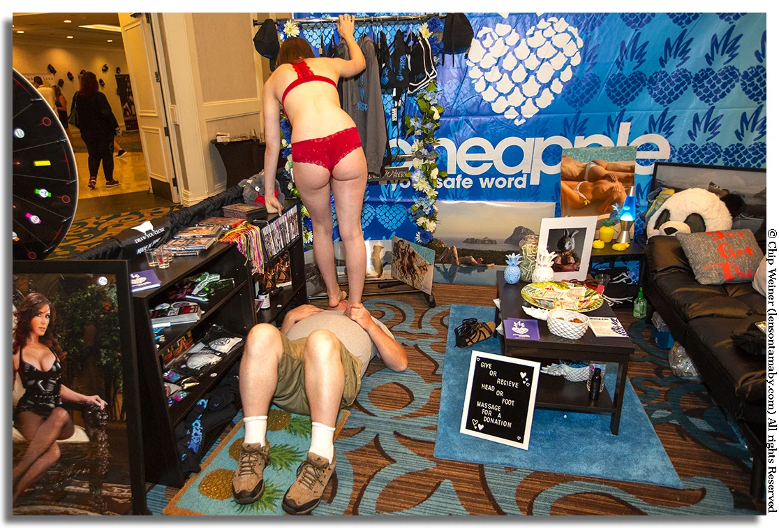 Fetish Con attendees can give or get a head or foot massage, or, get their face messaged by a foot as seen here, all for a donation.