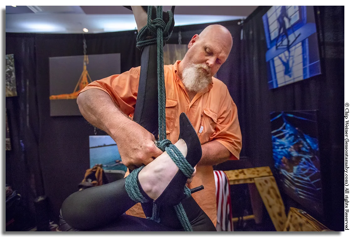 Ivan Boulder, rigger and producer, demonstrates proper techniques as part of a suspension exhibit.