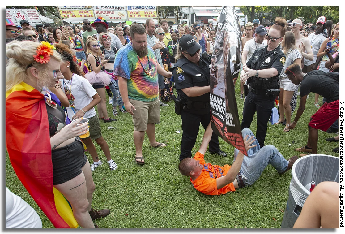 The man is helped to his feet