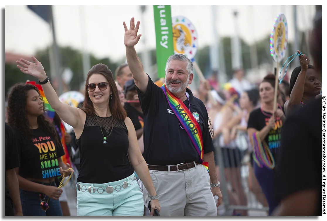 St Petersburg Mayor Rick Kriseman with his wife Kerry Kriseman march down Beach Drive. The pair, along with Congressman Charlie Crist made two appearances on Saturday. Once in front of the TransMarch and again in the main parade