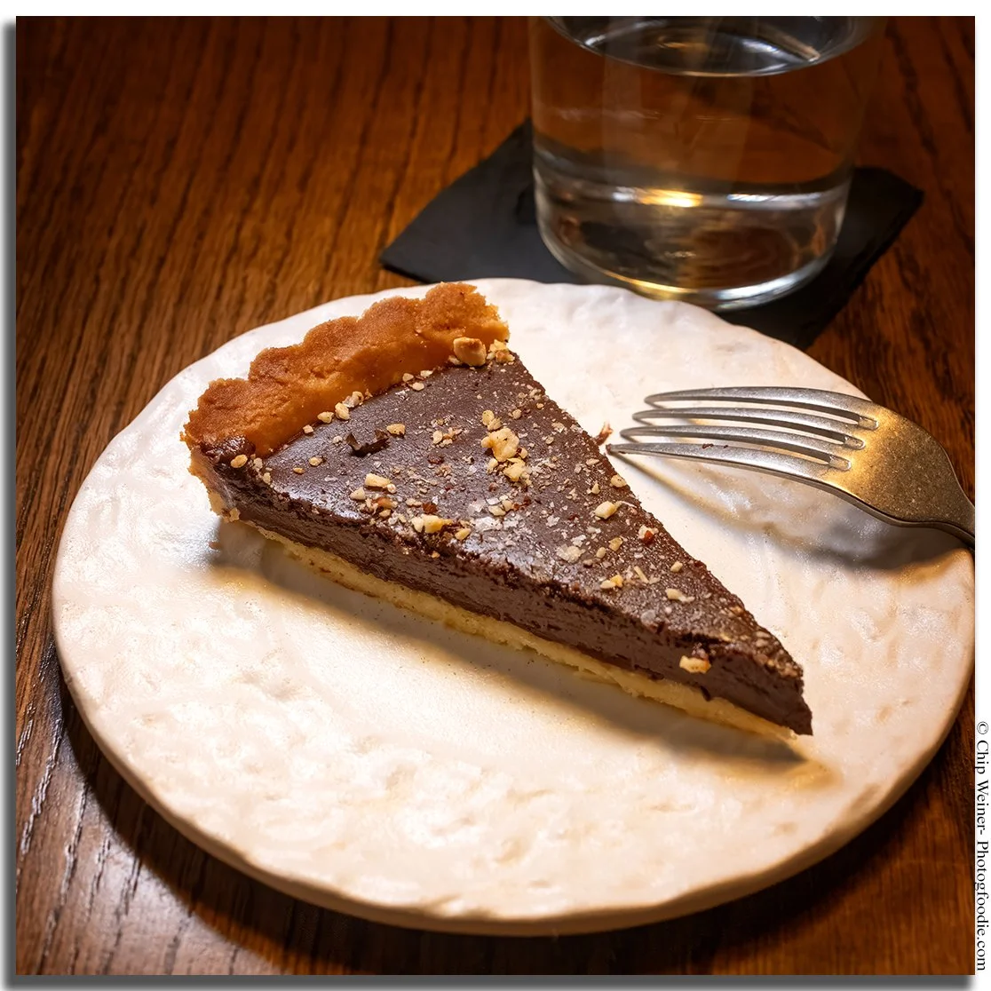 Dark chocolate tart at Kinjo with Italian hazelnut, shaved espresso, and Maldon sea salt