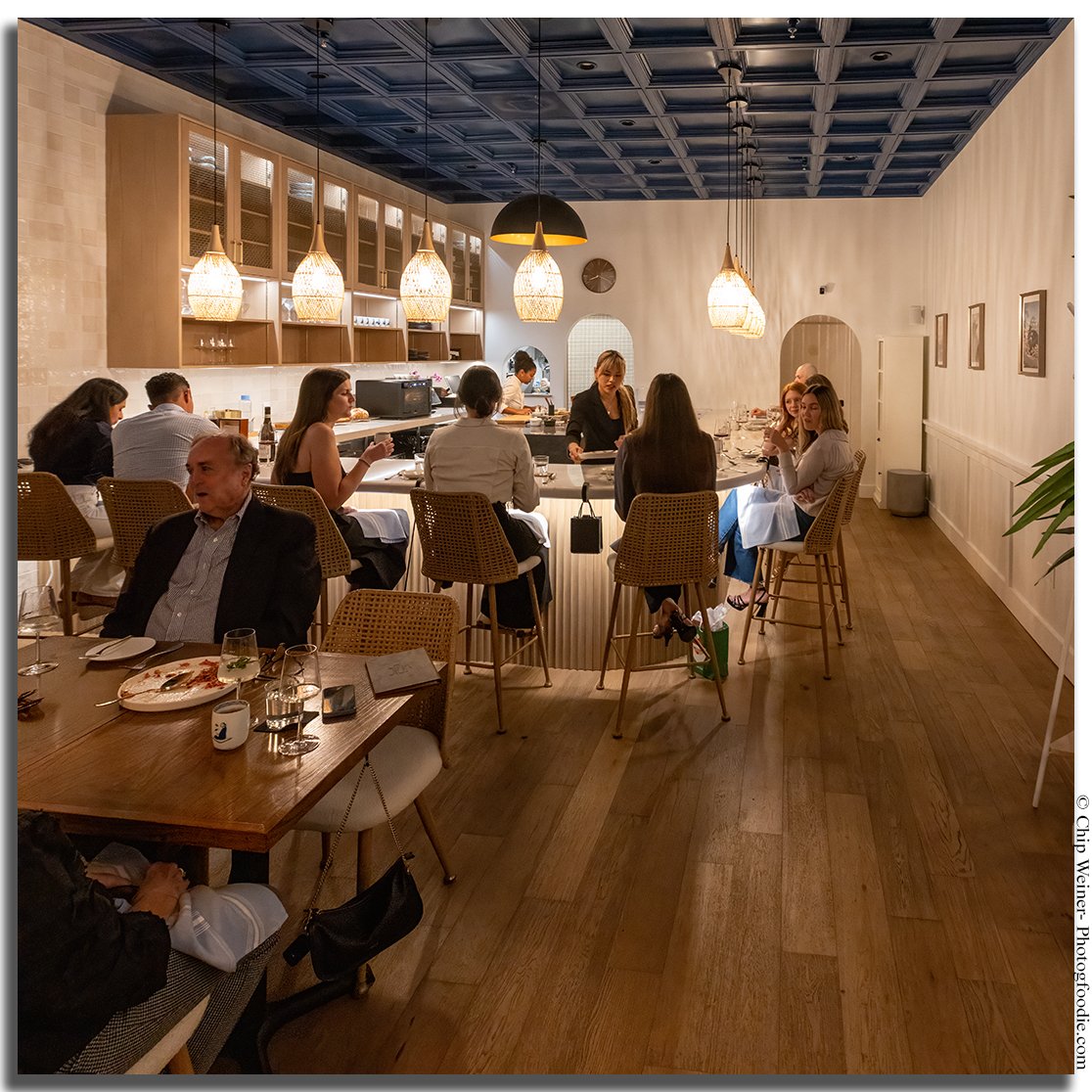 Chef’s counter dining experience at Kinjo featuring Japanese-Italian Itameshi cuisine prepared in an intimate setting