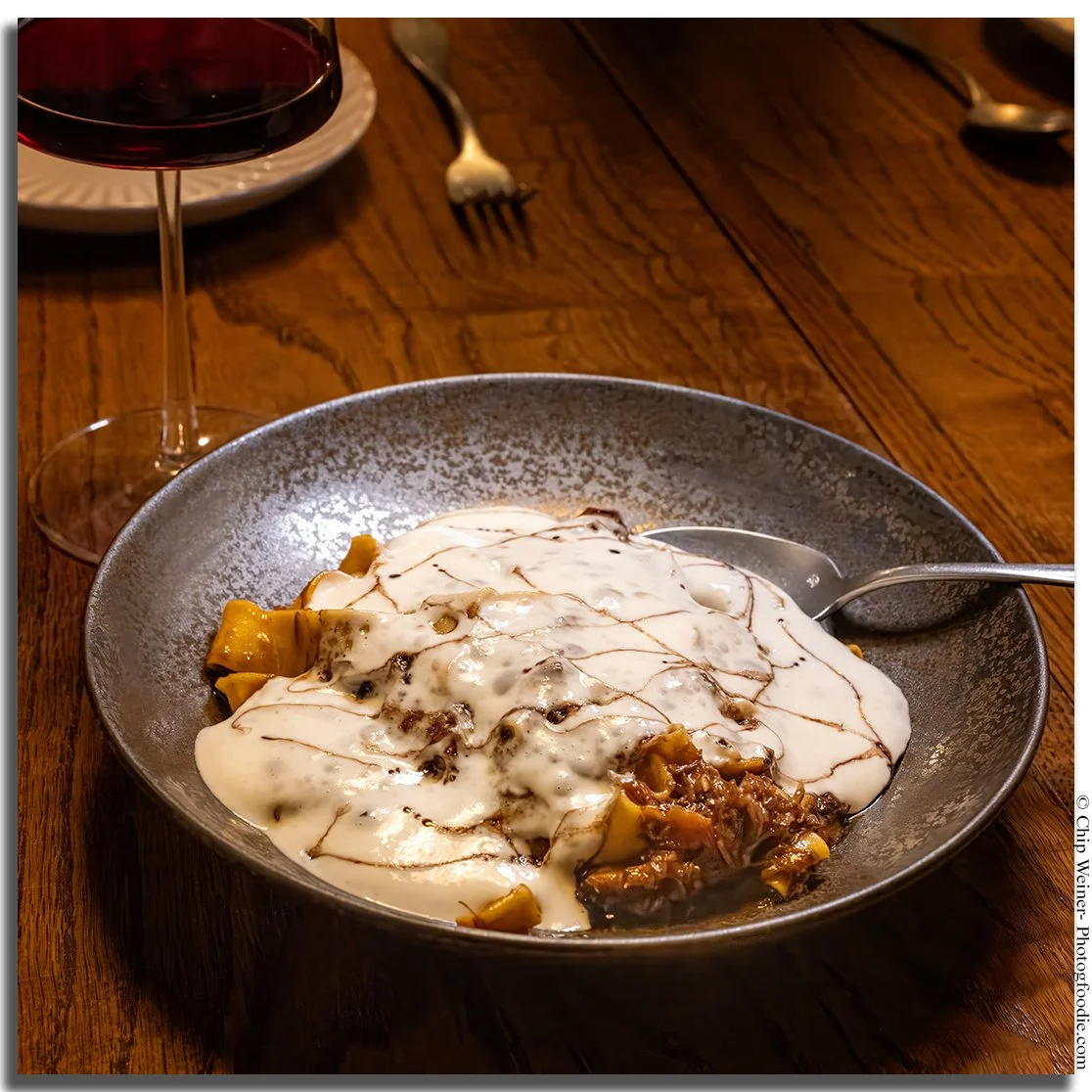 Pappardelle pasta with braised short rib, tobanjan chili paste, taleggio fondue, and aged balsamic at Kinjo