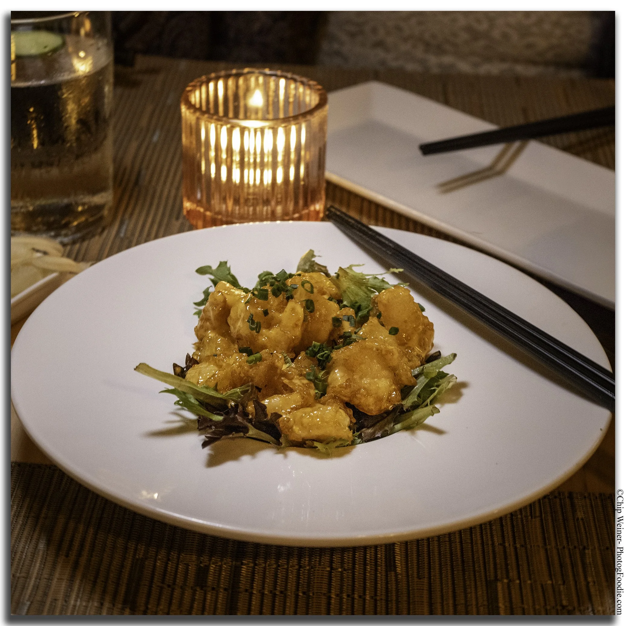 Rock shrimp at O-Ku Tampa, tossed in spicy aioli and garnished with fresh chives at the Japanese restaurant in Bayshore Gardens.