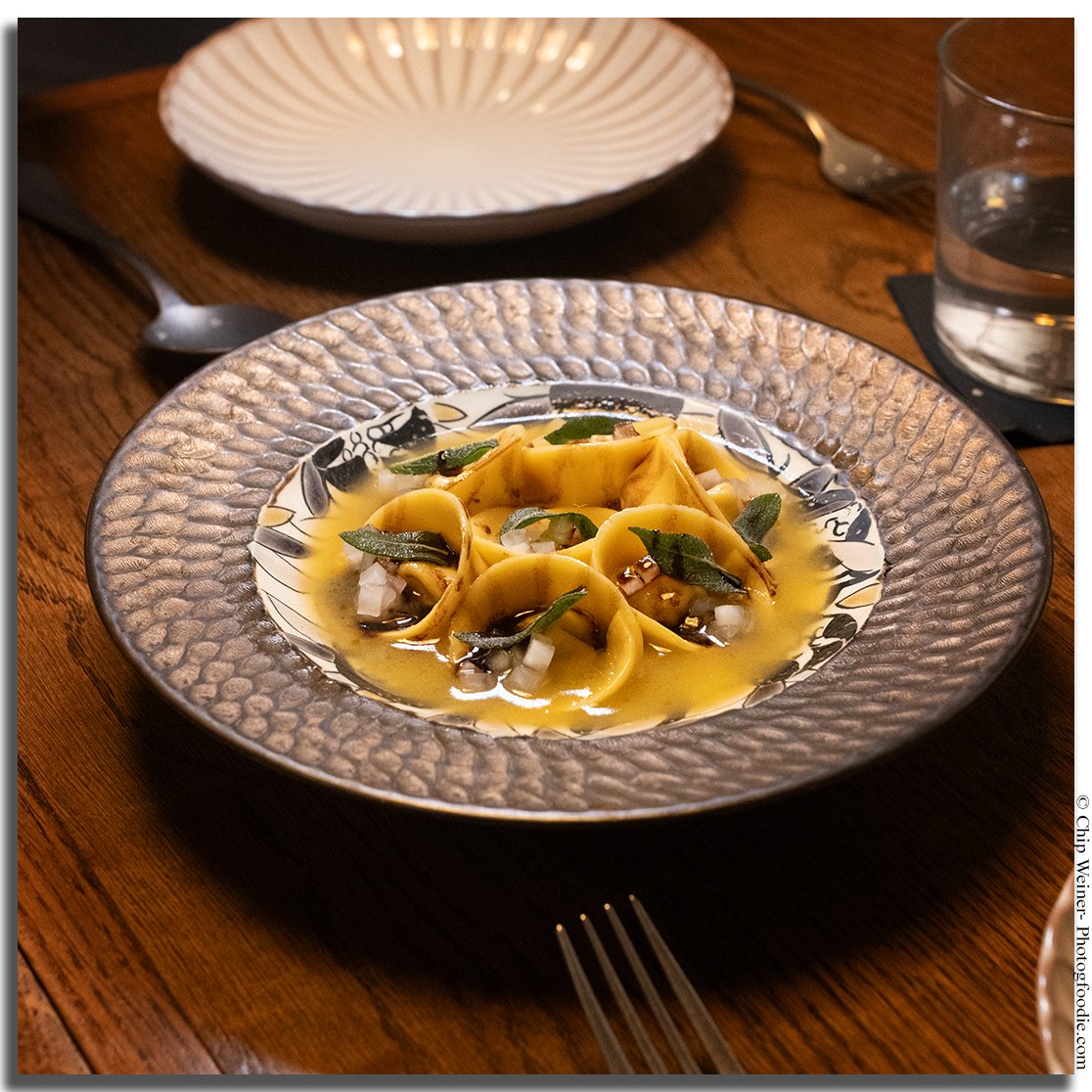 Ricotta cappelletti at Kinjo with brown butter, white soy maitake mushrooms, pickled daikon, and aged balsamic