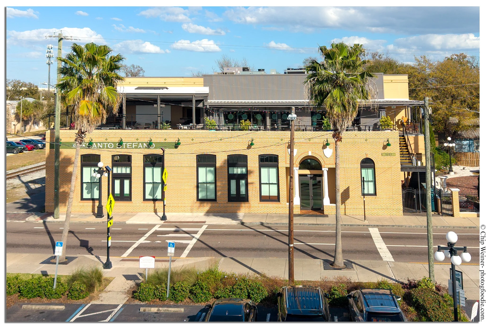 Casa Santo Stefano exterior in Ybor City with historic brick façade and welcoming entrance on 7th Avenue in Tampa’s Latin District.