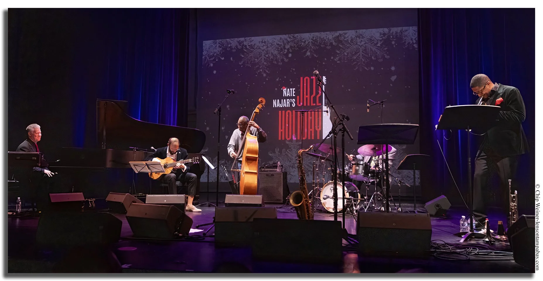 Nate Najar performing jazz guitar live on stage at the Palladium Theater during his annual Jazz Holiday concert in St. Petersburg, Florida.