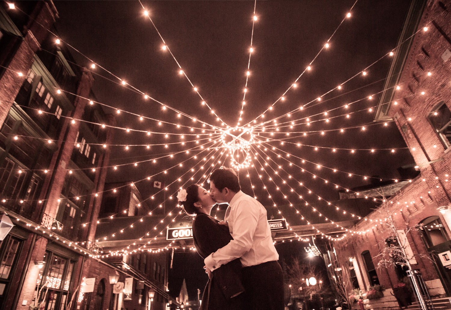 CONGRATULATIONS James & Hyuna A dreary cold winter day turned into an eclectic, engaging series of images that will be hard to top. January in Toronto's historic Distillery District was the photographic backdrop and playground for me, James, Hyuna and their closest friends. The cloudy day turned to cold night, but at no point could the wet and wonderful Canadian weather dampen our spirits. James and Hyuna you are wonderful couple and I had a blast taking your picture. A couple who truly loves each other create the best photographs, their genuine love shines through the image. It's more captivating and true than any artistic merit or photographic skill. Thank you both for choosing me as your photographer it was wonderful to be a witness. -J.B.
