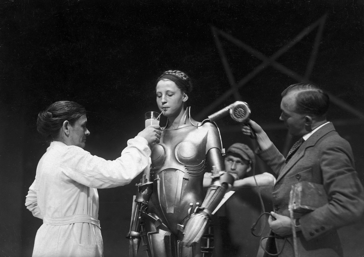 The Maschinenmensch (German for "machine-human") from Metropolis, is a gynoid (female robot and female android) played by German actress Brigitte Helm in both its robot form and human incarnation. Named Maria in the film, and "Futura" in the Novel, she was the first robot ever depicted in cinema. Robot Maria's haunting blank face, slightly open lips, and pronounced female curves in the film have been the subject of disgust and fascination alike.