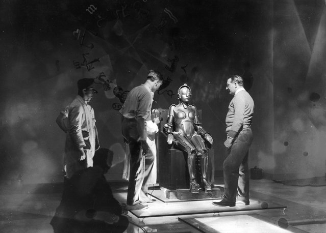 Lang (right) checks preparations for an upcoming scene. Metropolis, 1927.