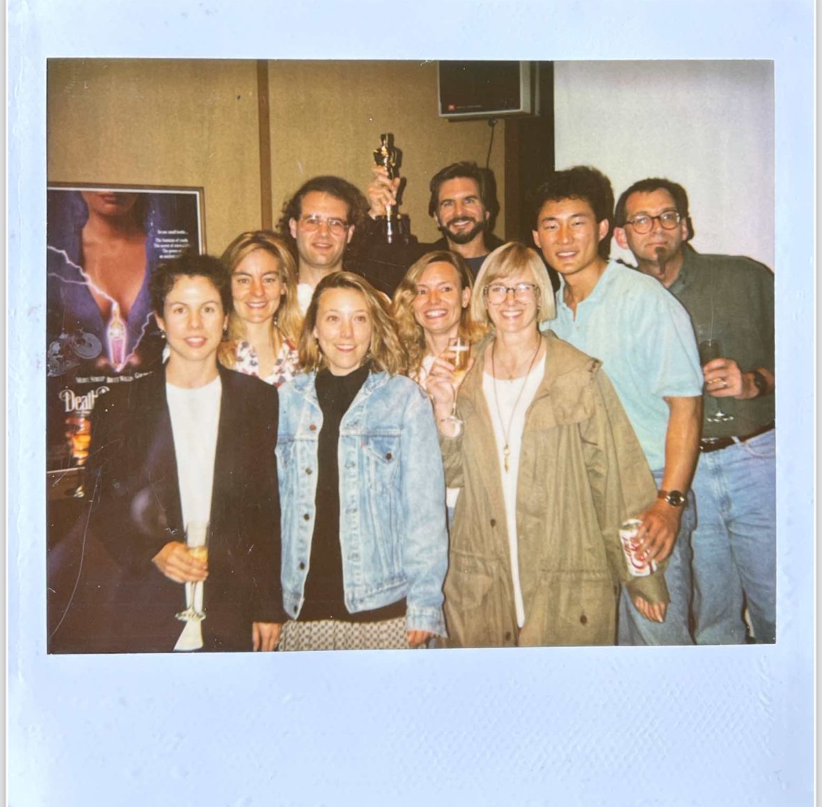  From left to right: Annie Calanchini, Jacqui Lopez, Doug Smythe, Judith Weaver, Gail Currey, Ken Ralston, Debbie Denise, Doug Chiang, and Bruce Vechitto. The production team from Death Becomes Her toasts the VFX Oscar for 1993 at the old ILM in San 