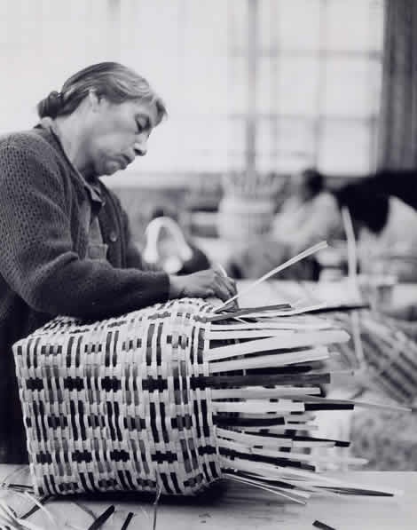 amanda smoker weaves a basket of white oak dyed with native plants. national archives and records administration photograph ~