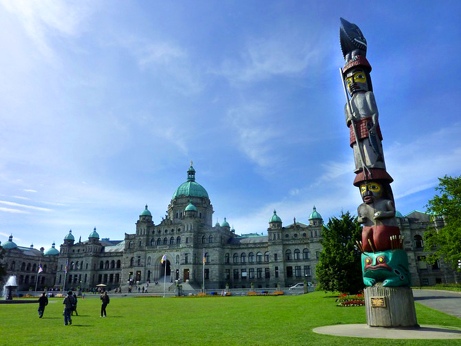 parliament building and totem pole in victoria ~