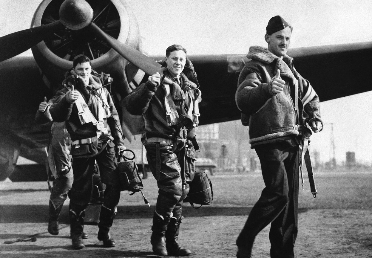 Members
of a British Royal Air Force bombing squadron hold thumbs up on April
22, 1940, as they return to home base from an attack on German warships
off Bergen, Norway. (AP Photo)