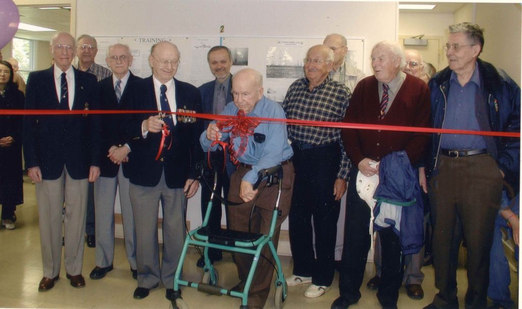 May 24, 2003 Ribbon cutting at the newly opened Secrets of Radar Museum. Pictured L-R: Albert James, unknown, James Sands, Donald Harrett, Bob Wood (MPP), G. Fred Bates, David Meltzer, John Callingham, James Henderson, Clark Aylward, Roy Taylor