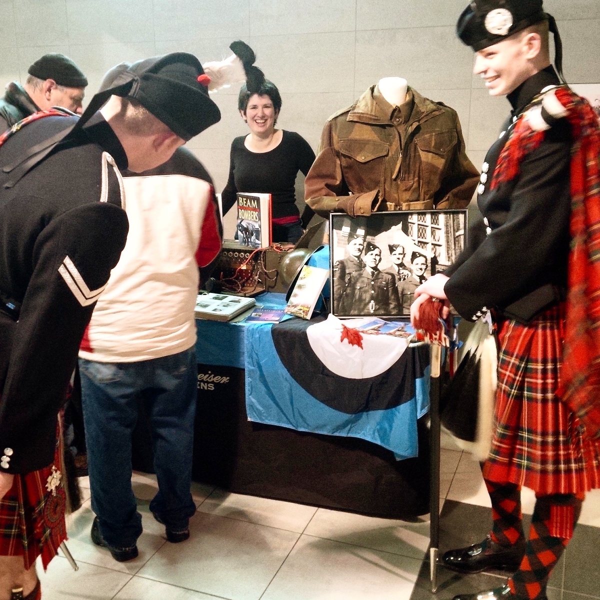 Two Highland dancers of the 1st Batalion Scots Guard visit the display. 