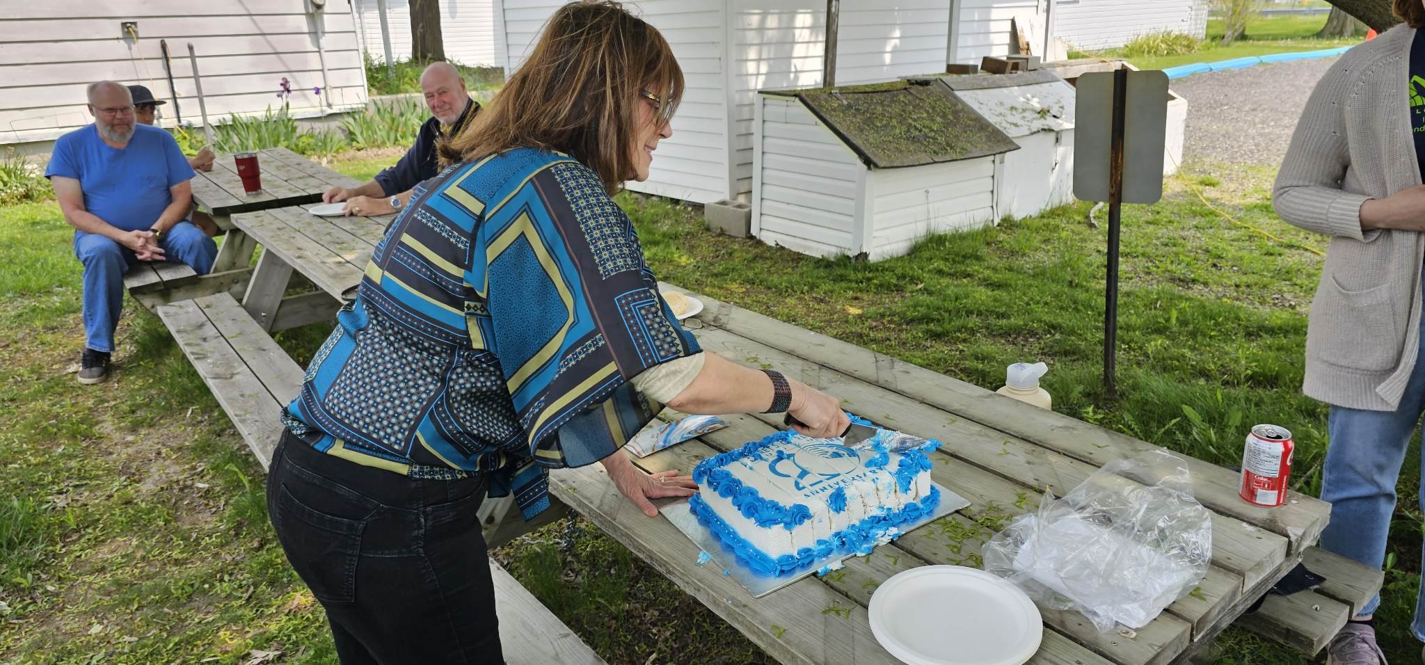 Theresa cuts cake.jpeg